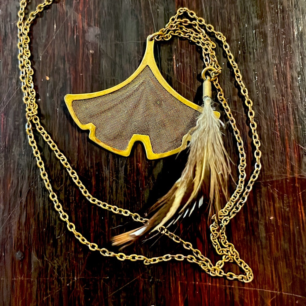 Brassy chain and leaf. Feather is real.